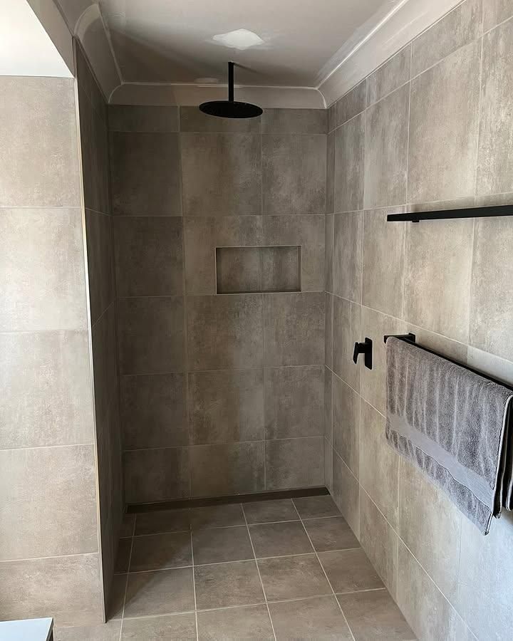 A Bathroom with A Walk in Shower and A Towel Rack — Bowral Bathrooms in Exeter, NSW