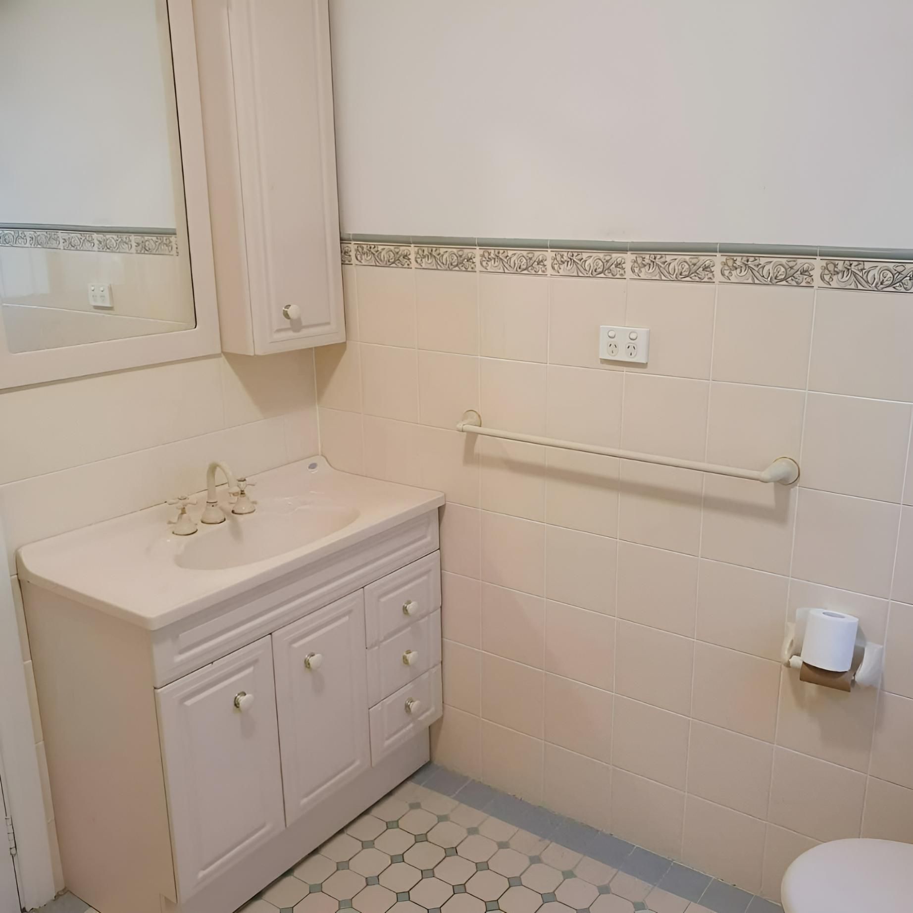 A Before Image of Bathroom with A Sink, Toilet and Mirror — Bowral Bathrooms in Exeter, NSW