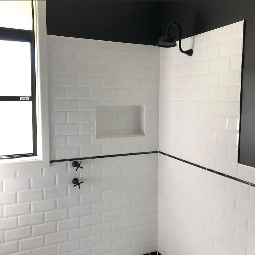 A Bathroom with White Tiles and A Black Ceiling — Bowral Bathrooms in Exeter, NSW