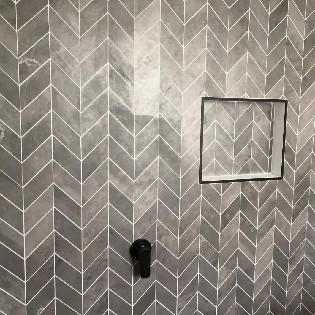 A Shower with A Chevron Pattern on The Wall and A Square Shower Niche — Bowral Bathrooms in Berrima, NSW