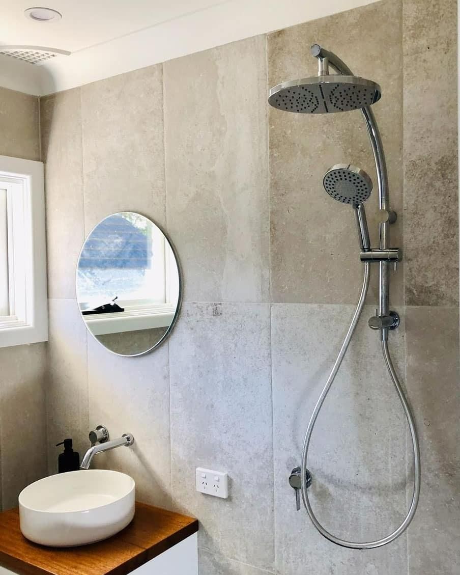 A Bathroom with A Sink, Shower, Mirror and Shower Head — Bowral Bathrooms in Exeter, NSW
