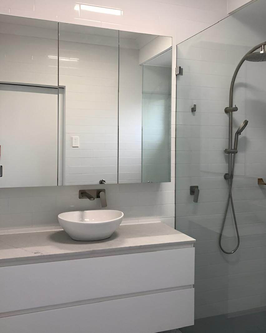 A Bathroom with A Sink a Mirror and A Shower — Bowral Bathrooms in Moss Vale, NSW