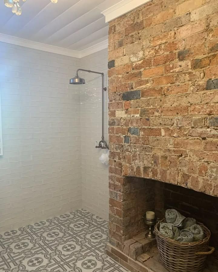 A Bathroom with A Brick Fireplace and A Shower — Bowral Bathrooms in Exeter, NSW
