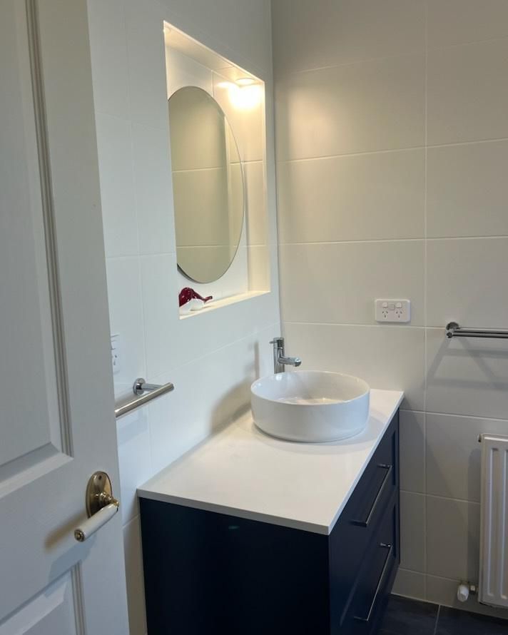 A Bathroom with A Sink and A Mirror on The Wall — Bowral Bathrooms in Exeter, NSW
