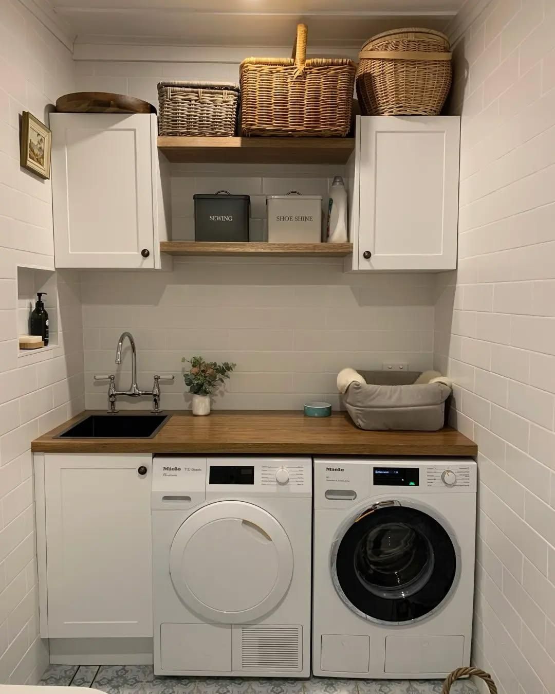 A Tiled Laundry Room with A Washer and Dryer — Bowral Bathrooms in Exeter, NSW