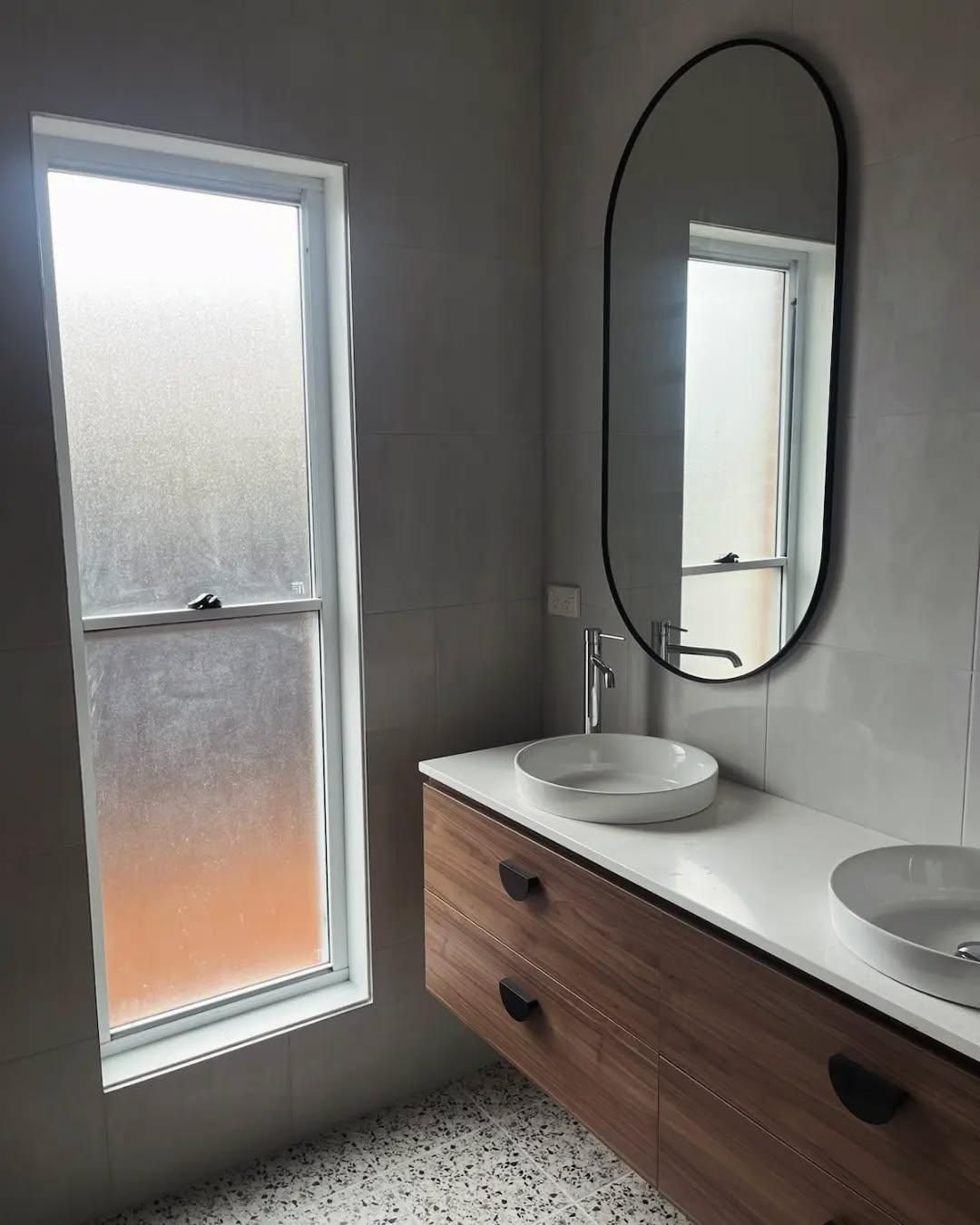 A Bathroom with A Sink, Mirror and Window — Bowral Bathrooms in Exeter, NSW