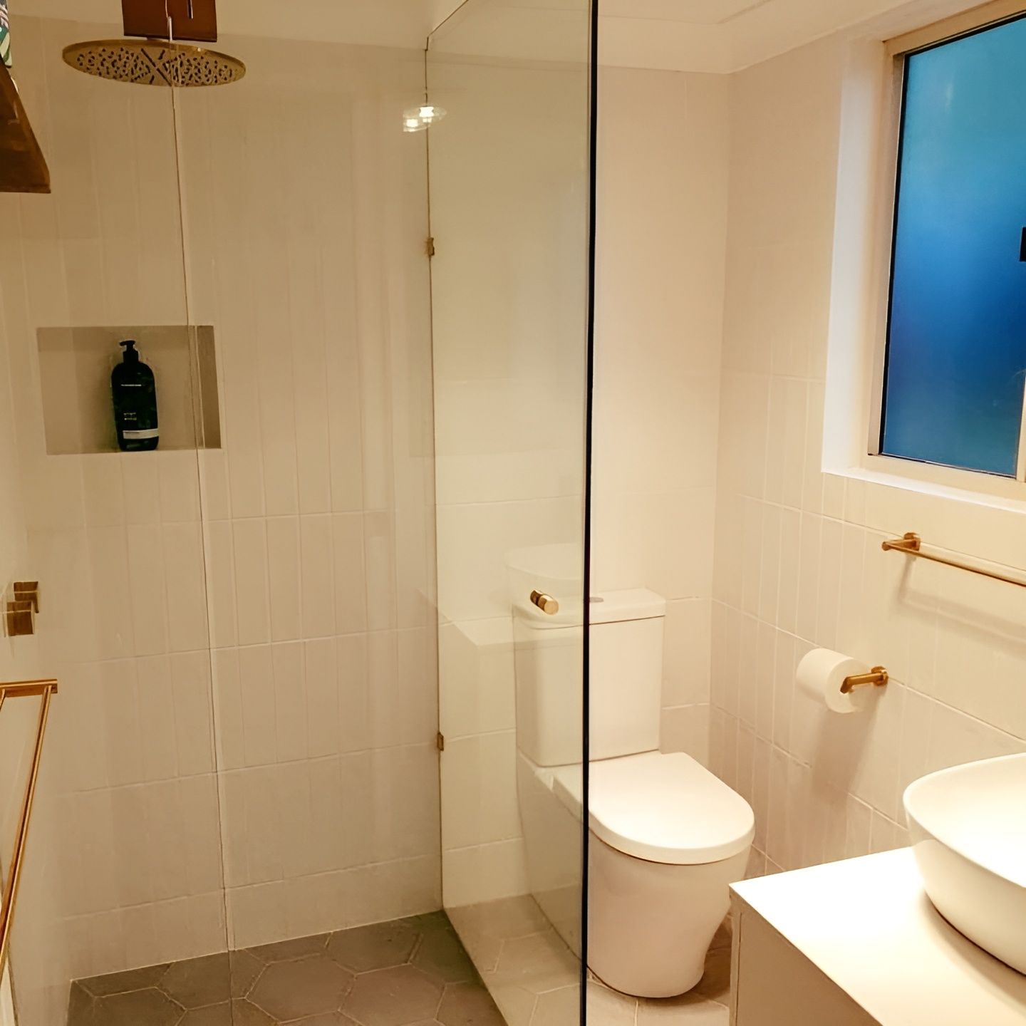An After Image of Bathroom with A Toilet, Sink and Shower — Bowral Bathrooms in Exeter, NSW