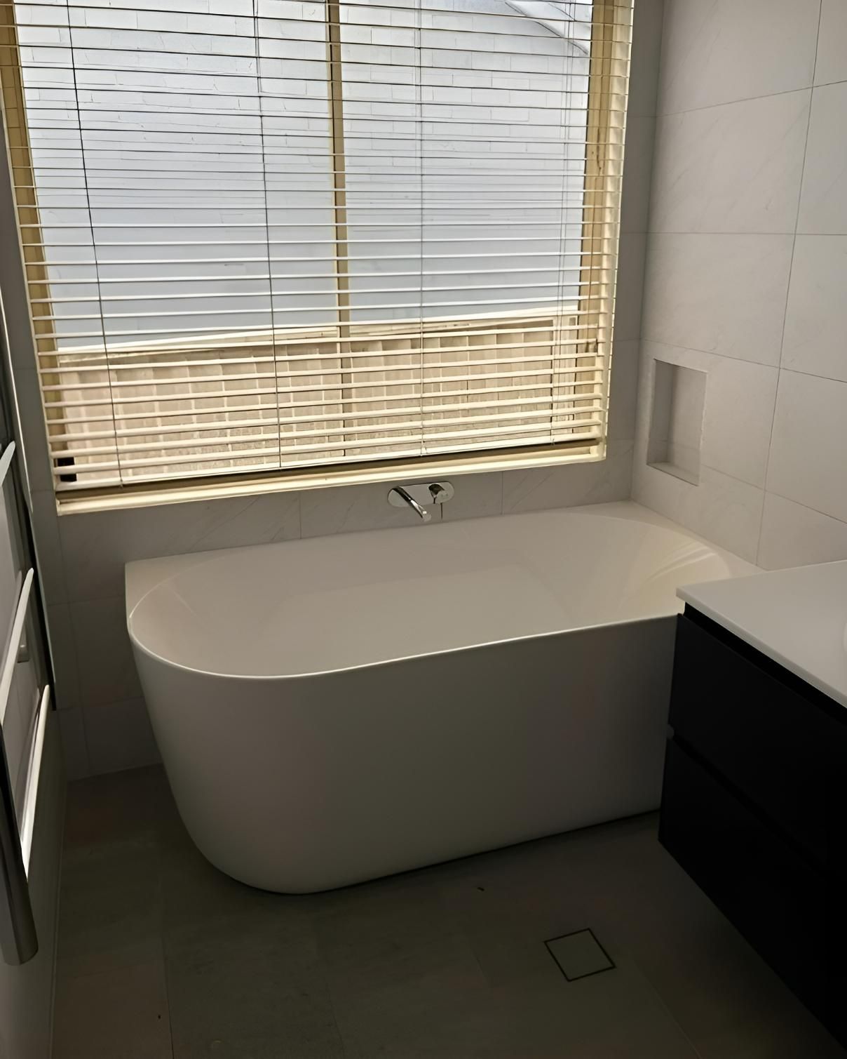 An After Image of Bathroom with A Bathtub and A Window with Blinds — Bowral Bathrooms in Exeter, NSW