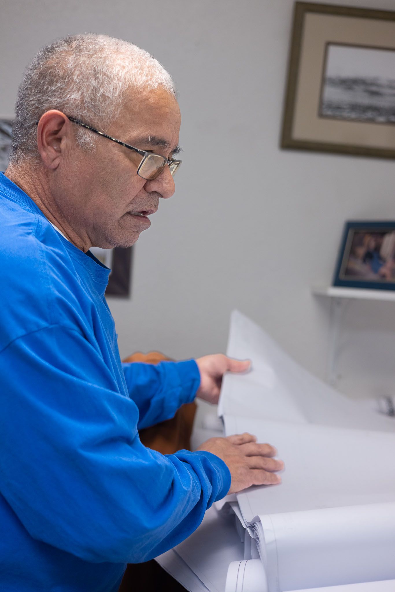 Nightlight Electric employee viewing drawing of electrical plans