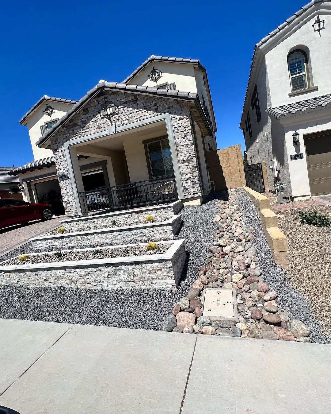 A couple of houses are sitting next to each other on a sunny day.
