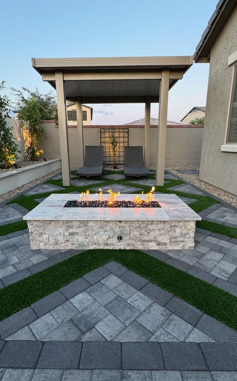 There is a fire pit in the middle of the patio.