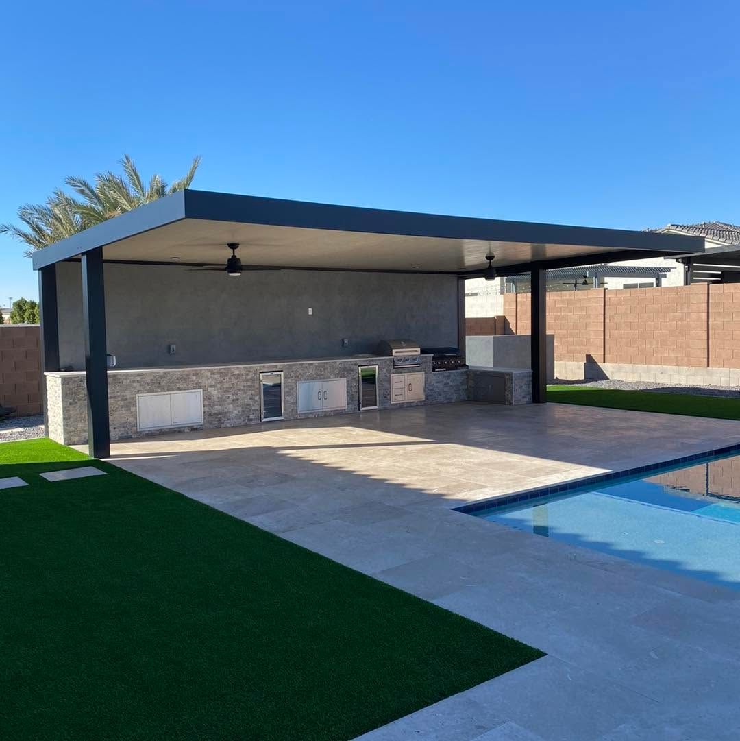 A patio with a covered area and a swimming pool