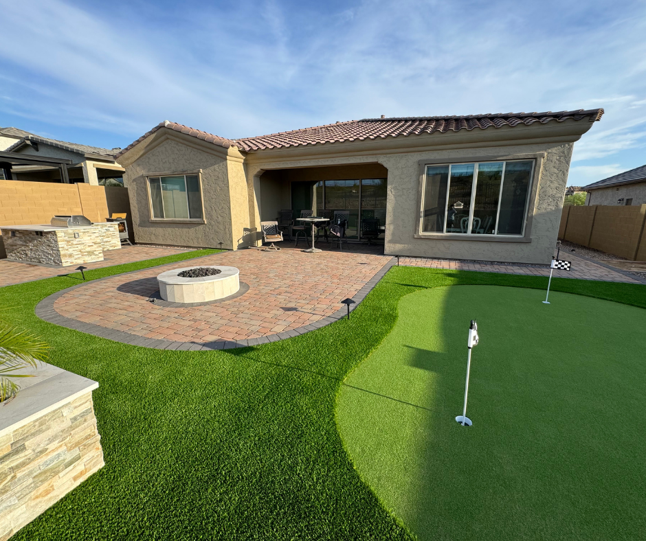A house with a putting green in front of it