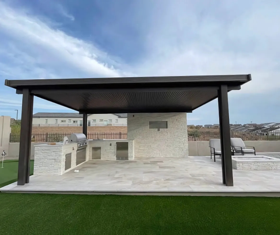 A patio with a pergola and chairs on it