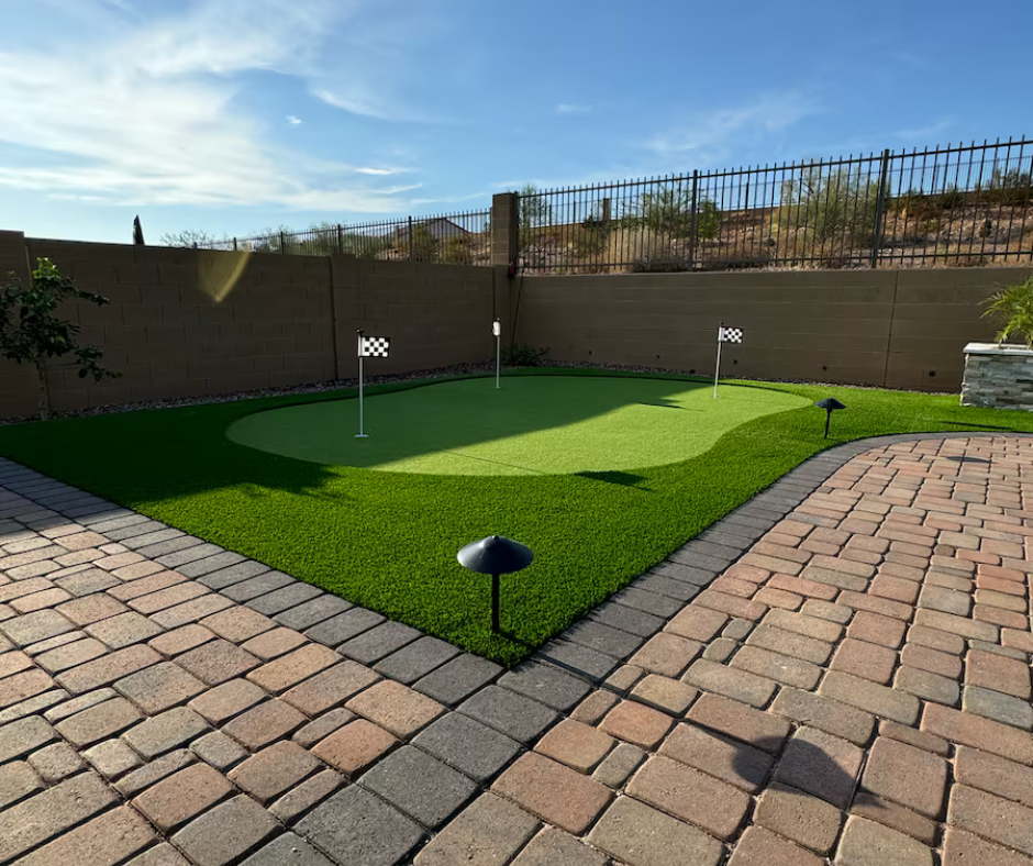 A brick patio with a putting green in the middle