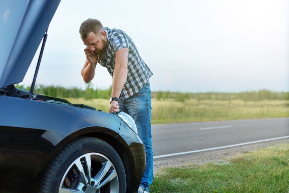 Man is Looking Under the Hood of His Broken Down Car — 365 Towing Taree in Newcastle, NSW