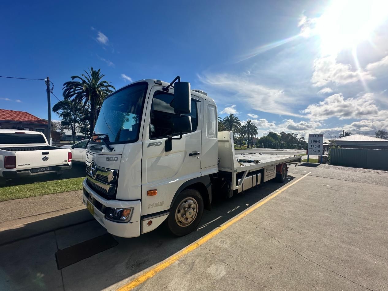 White Tow Truck is Parked on the Side of the Road — 365 Towing Taree in Harrington, NSW