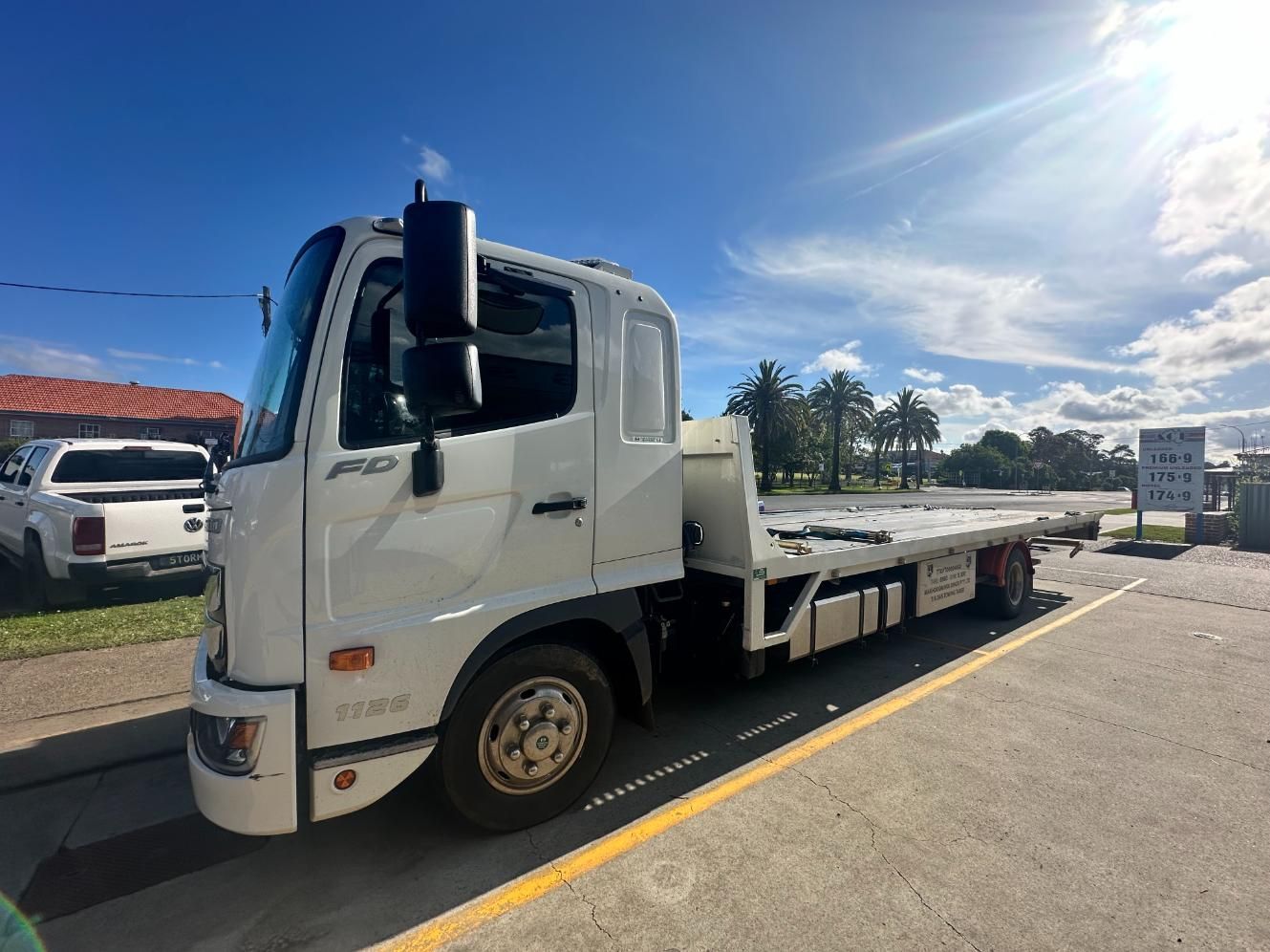 White Tow Truck is Parked on the Side of the Road — 365 Towing Taree in Oldbar, NSW