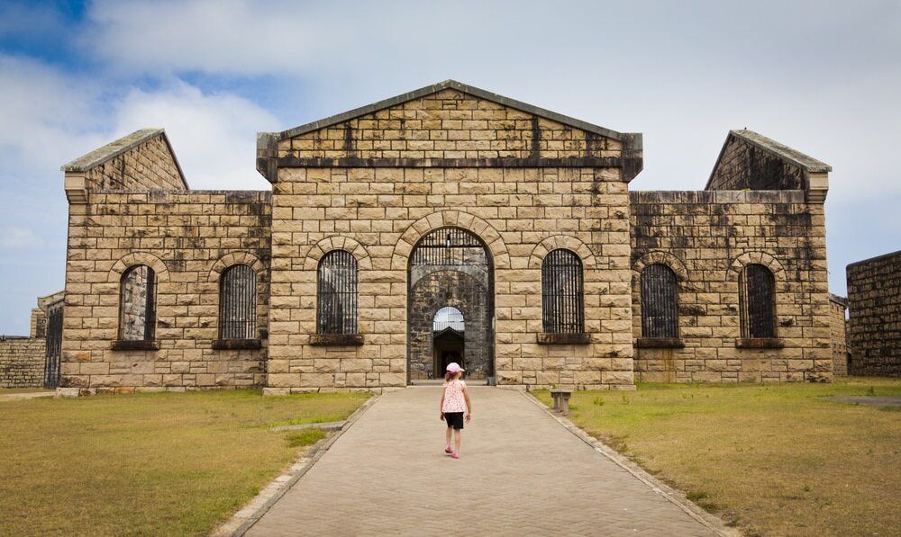 Little Girl is Walking in Front of a Large Brick Building — 365 Towing Taree in Oldbar, NSW