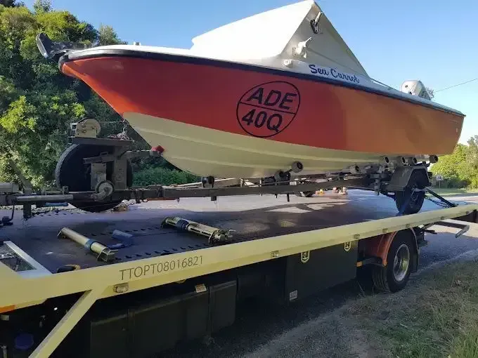 Boat is Being Towed by a Trailer in the Water — 365 Towing Taree in Wingham, NSW