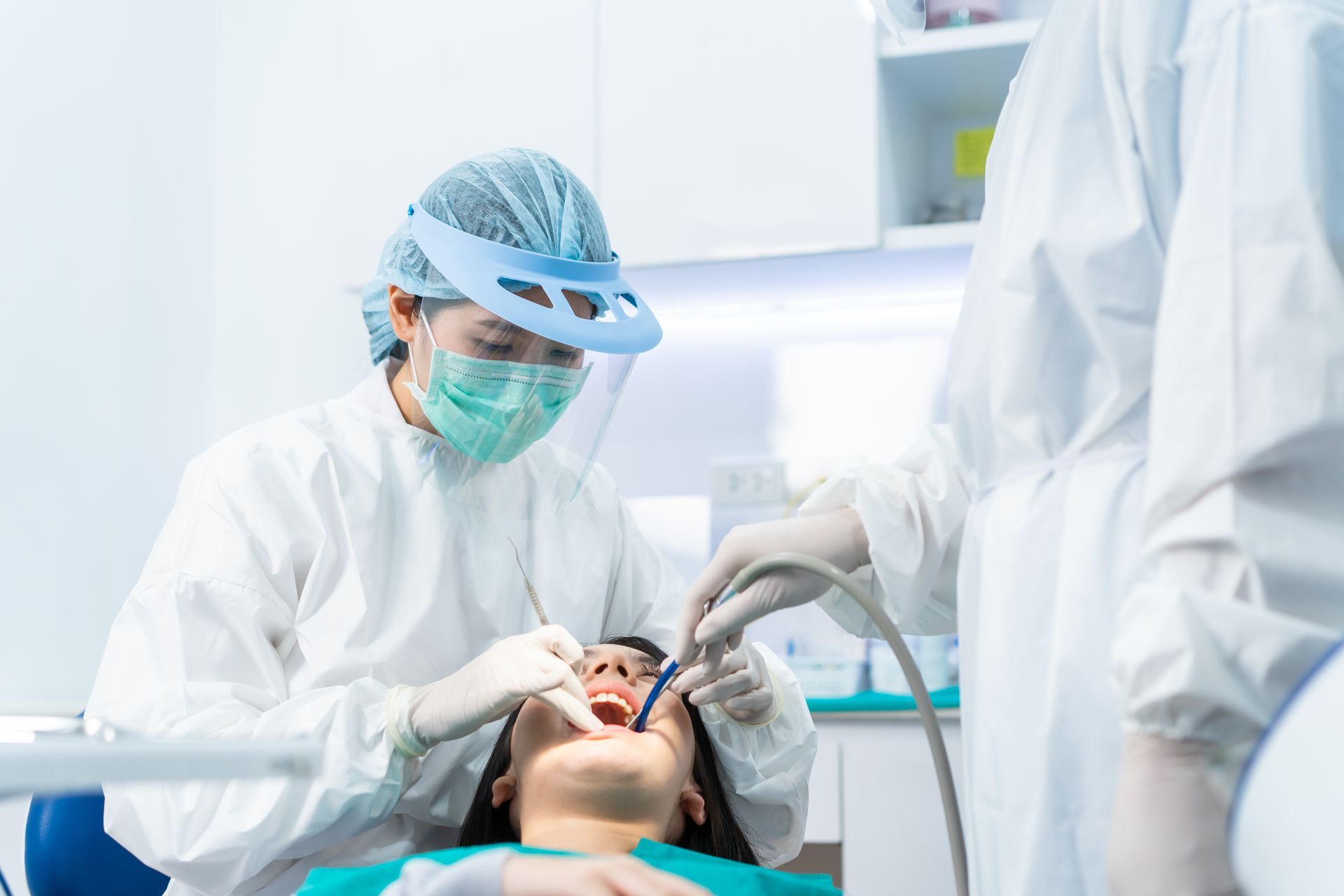 a dentist replacing an extracted tooth