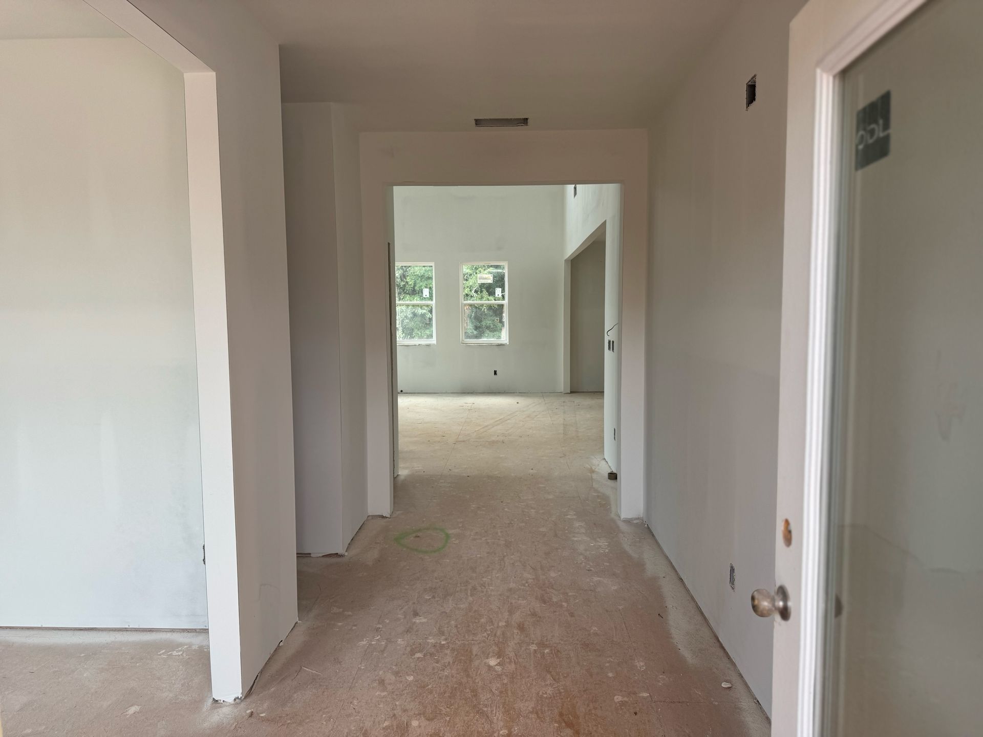 A hallway in a house that is being built.