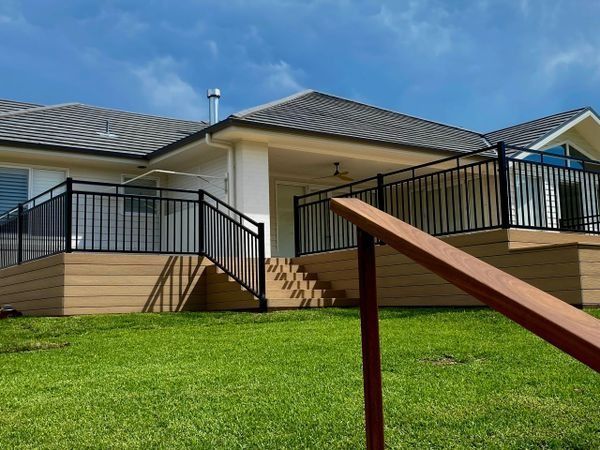 A House with A Deck Featuring a Black Metal Railing — CAW Services in Badagarang, NSW