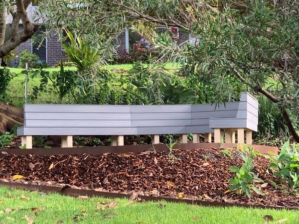 Grey and White Raised Garden Bed with Wood Supports — CAW Services in Badagarang, NSW