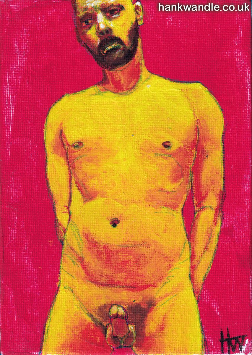 a man standing naked against a red background, hands behind his back, penis erect