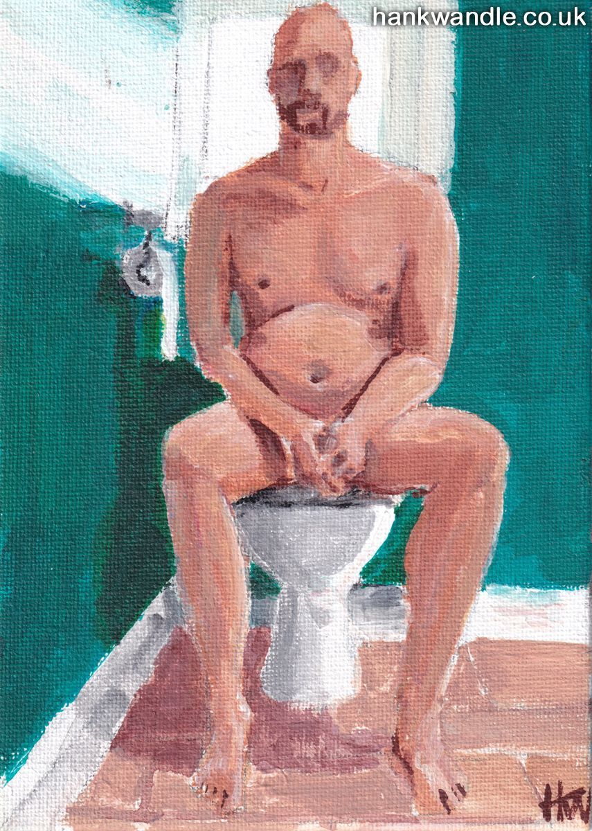 a naked man sits on a toilet, he clasps his hands together in his lap