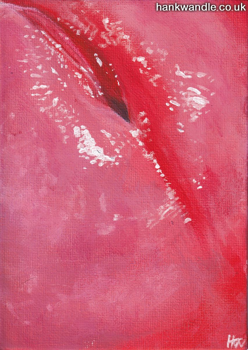 an extremely close view of the head of an erect penis, the hole glistens at the top left of the frame