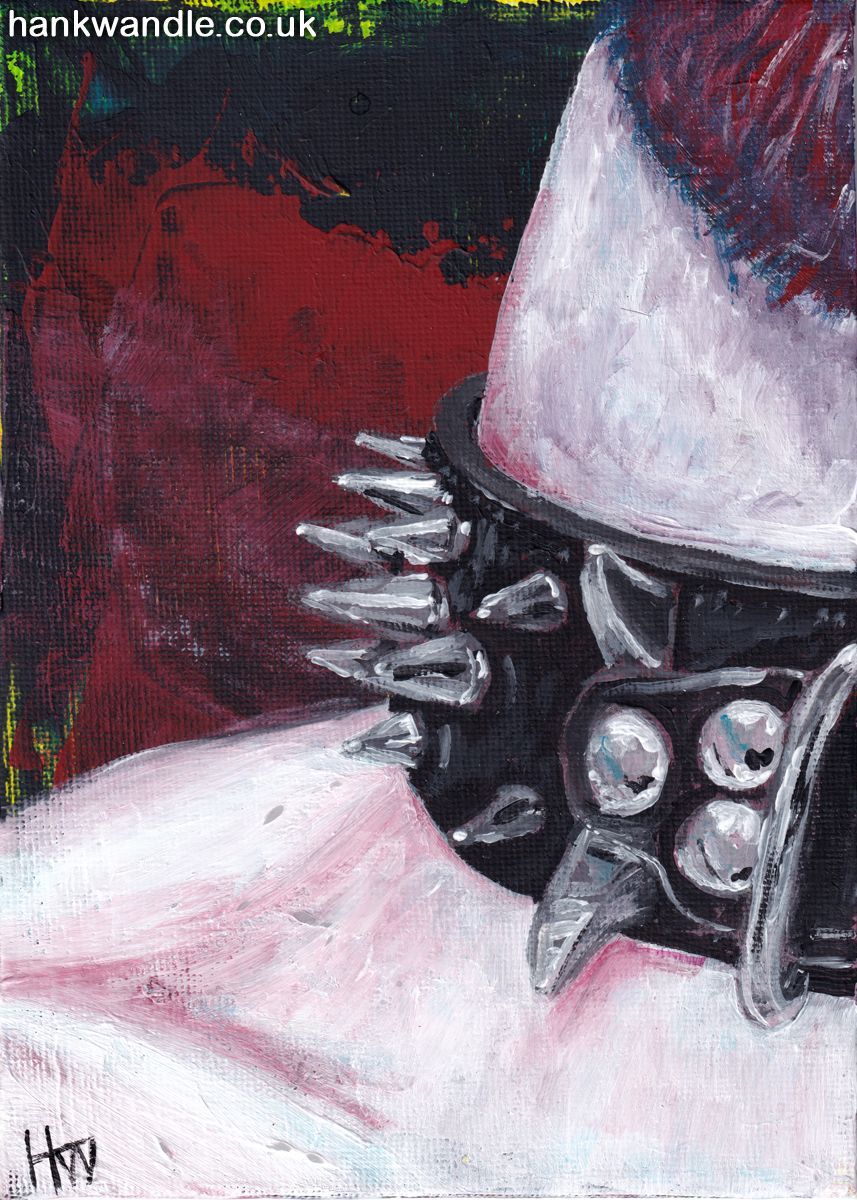 an otherwise naked throat wears a heavily studded and spiked leather dog collar