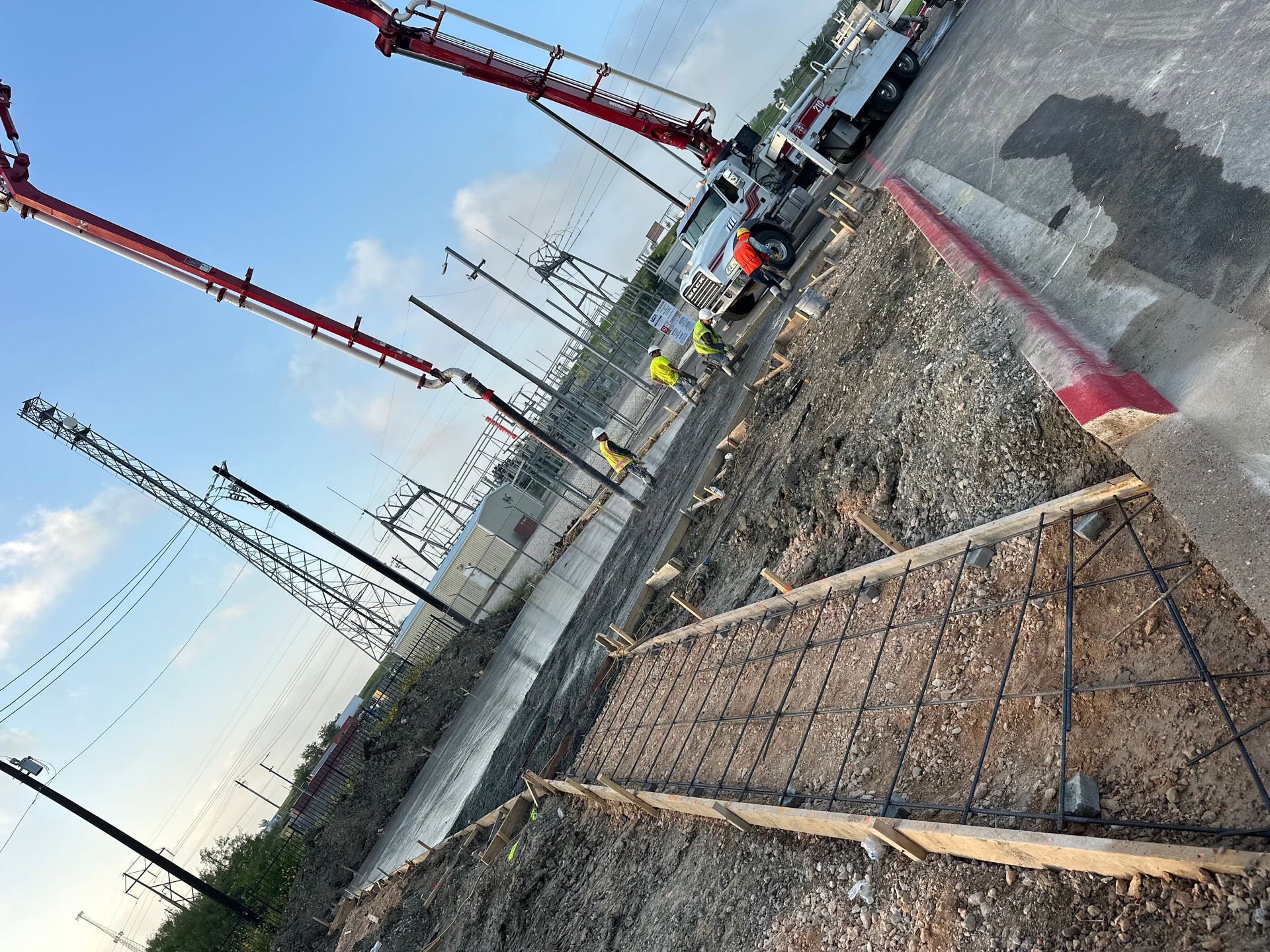 A group of construction workers are working on a construction site.