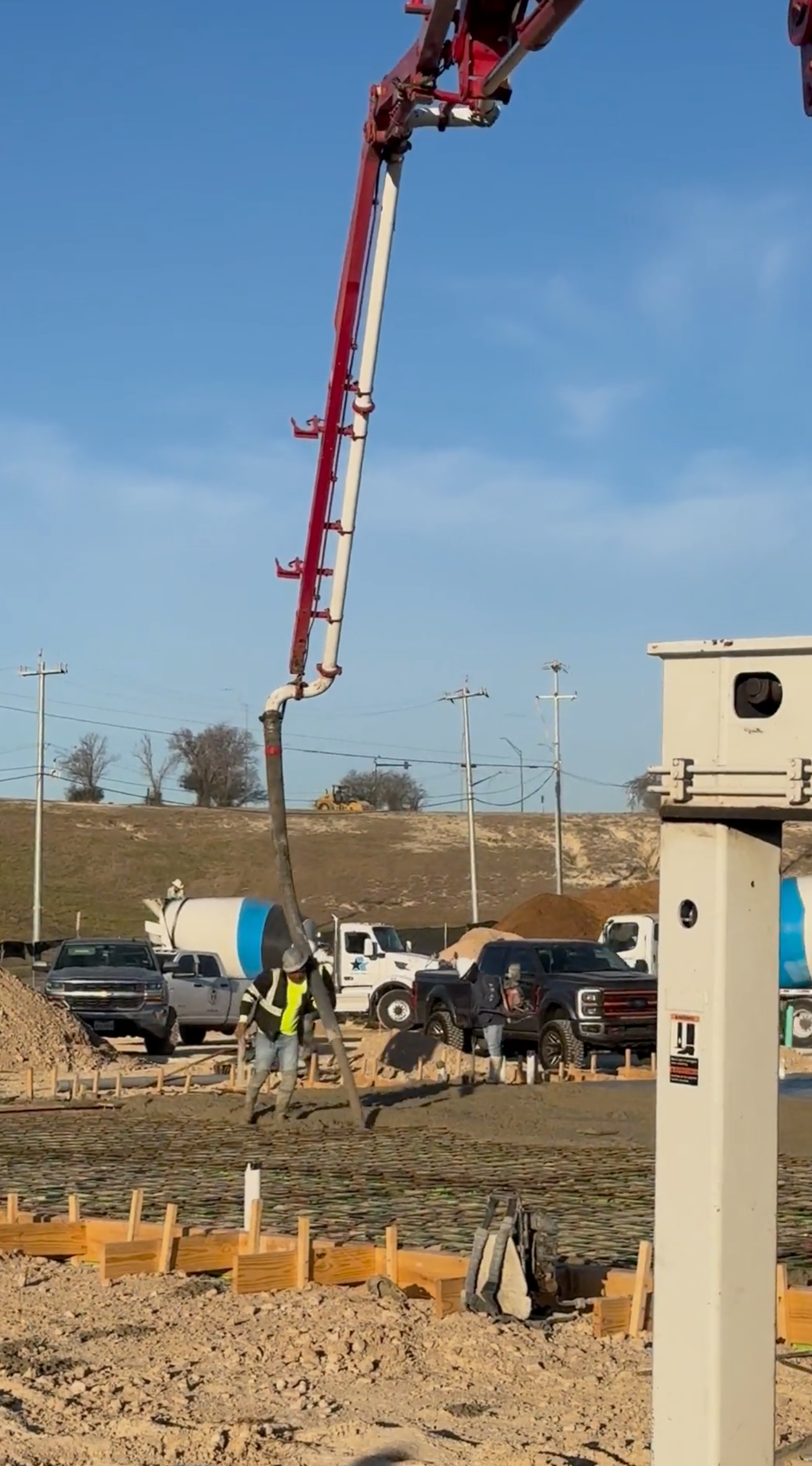 A concrete pump is being used on a construction site