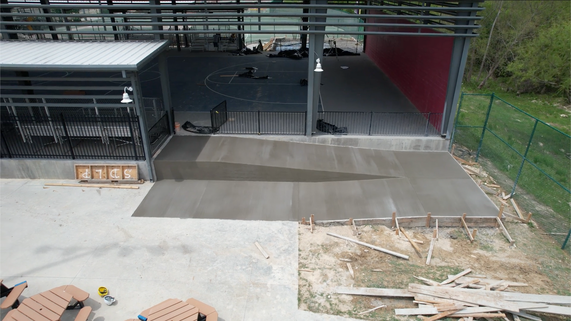 An aerial view of a building under construction with a concrete floor.