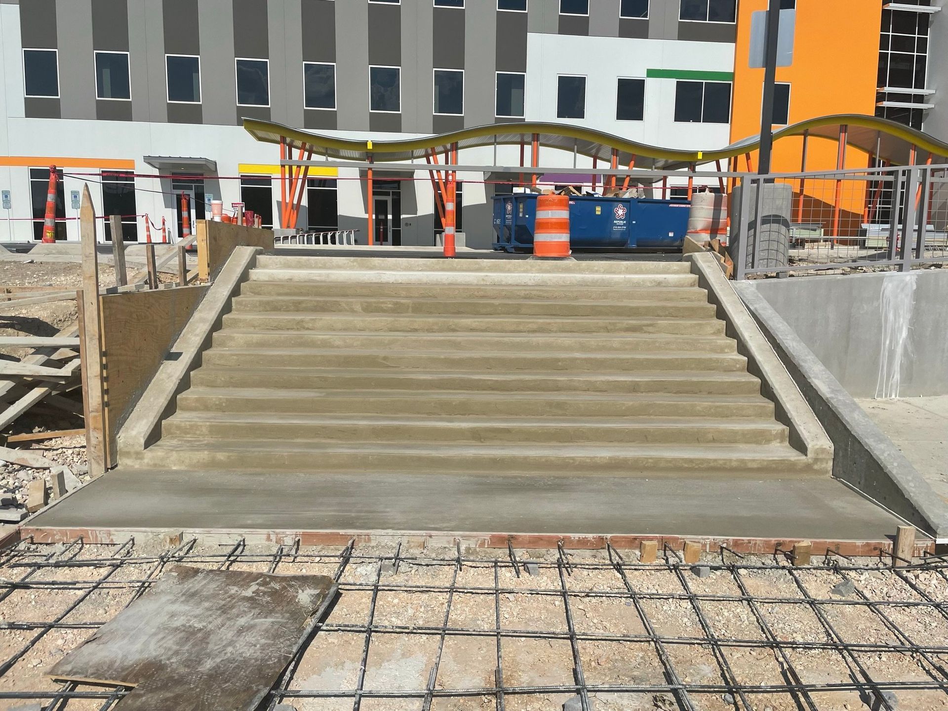 Concrete stairs are being built in front of a building