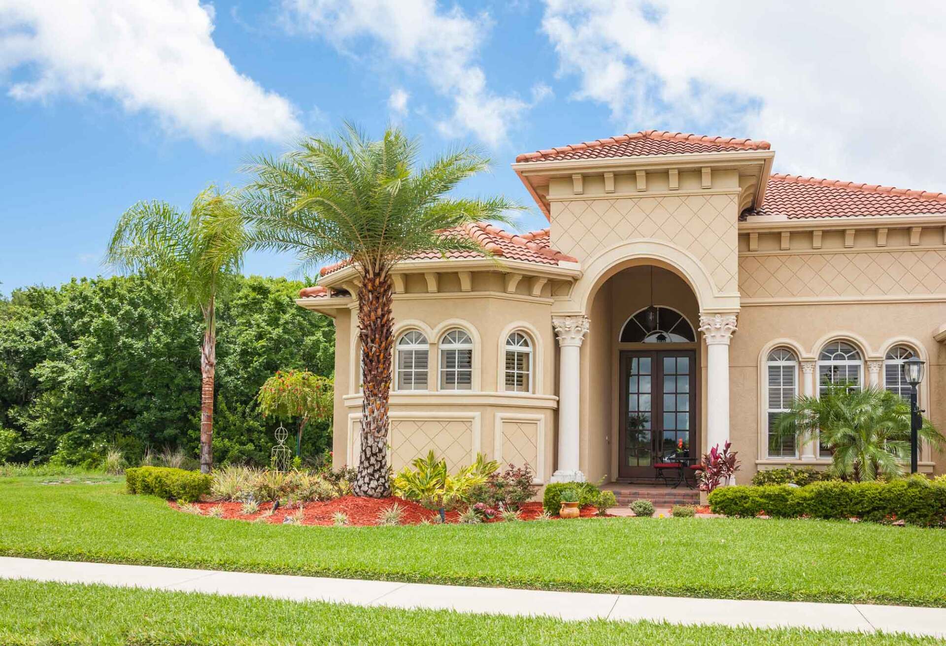 Luxury Home with Palm Trees and Front Lawn — Tallahassee, FL — Tallahasse Lawn Salon
