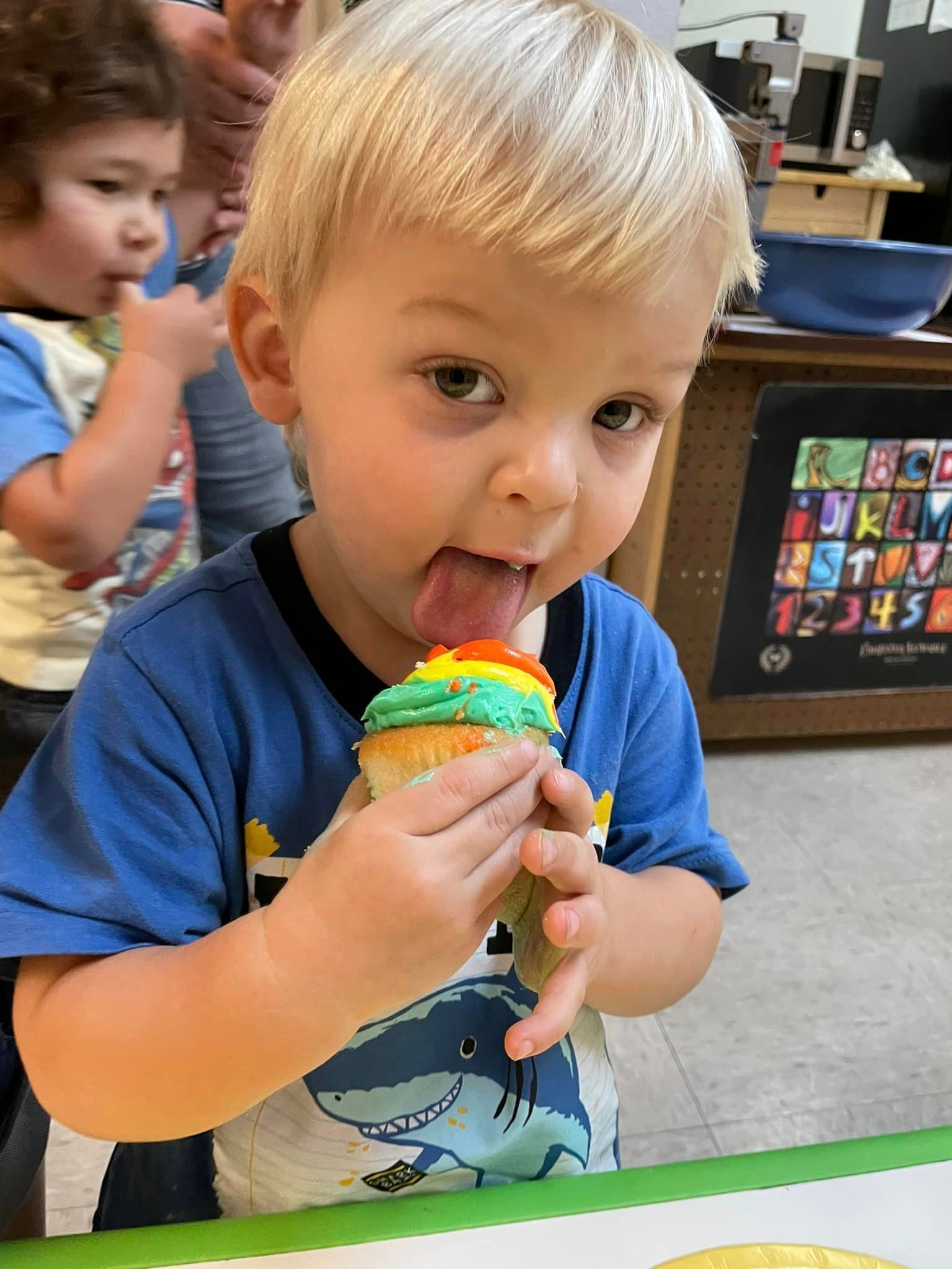 toddler eating a cupcake