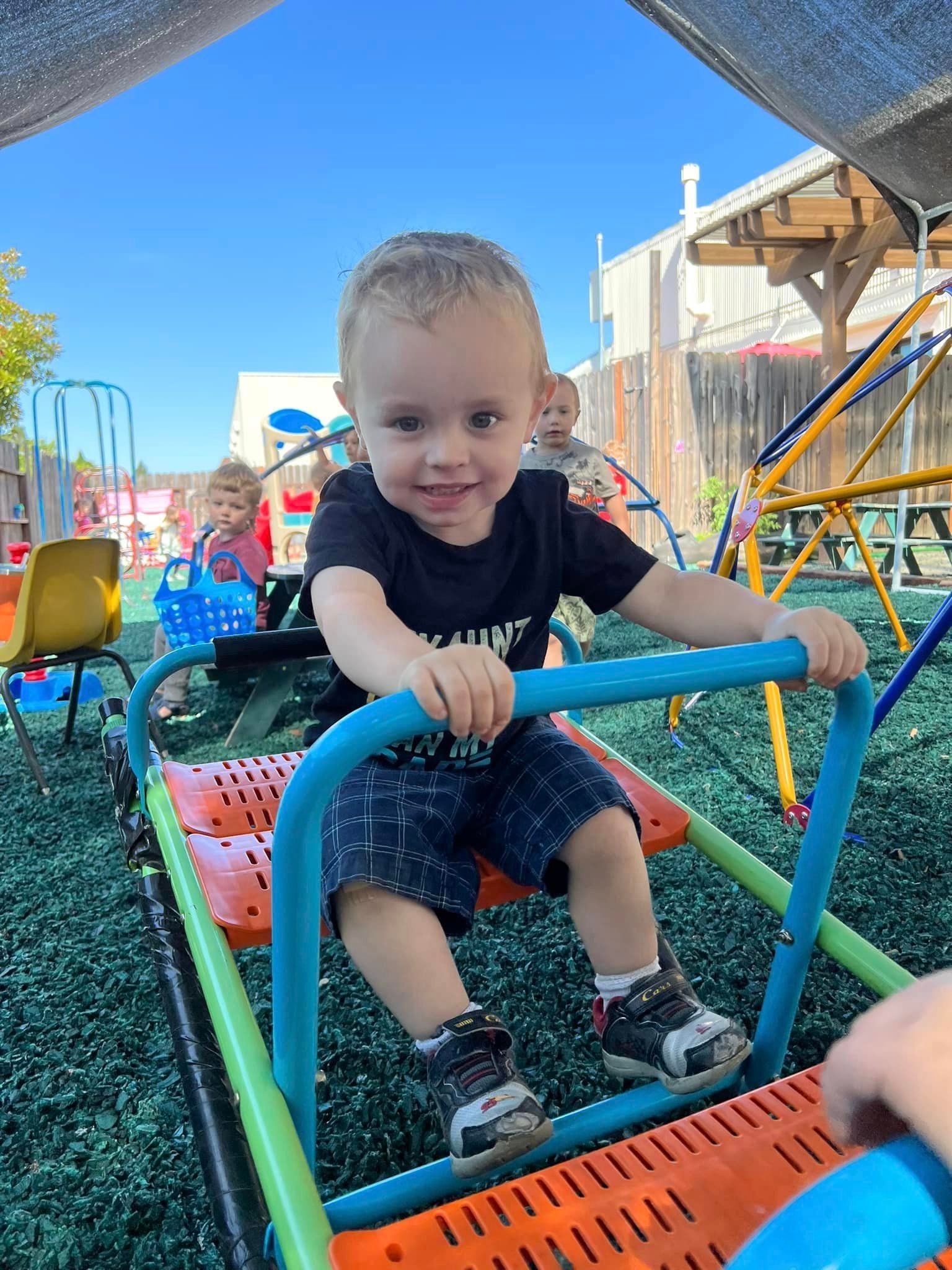 toddler playing at playground