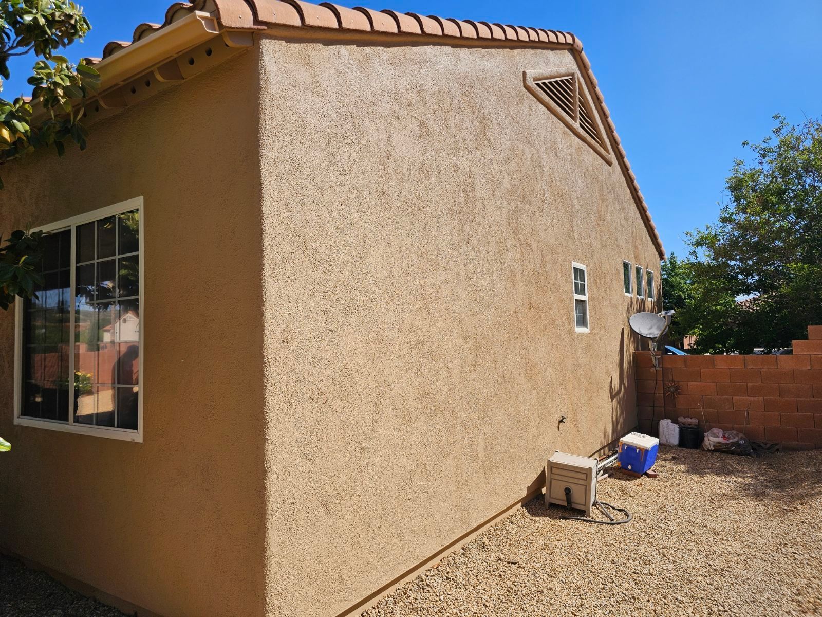 A house with a satellite dish on the side of it