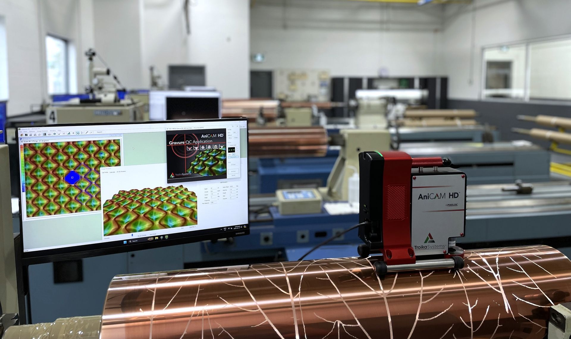 A man is working on a machine in a factory.