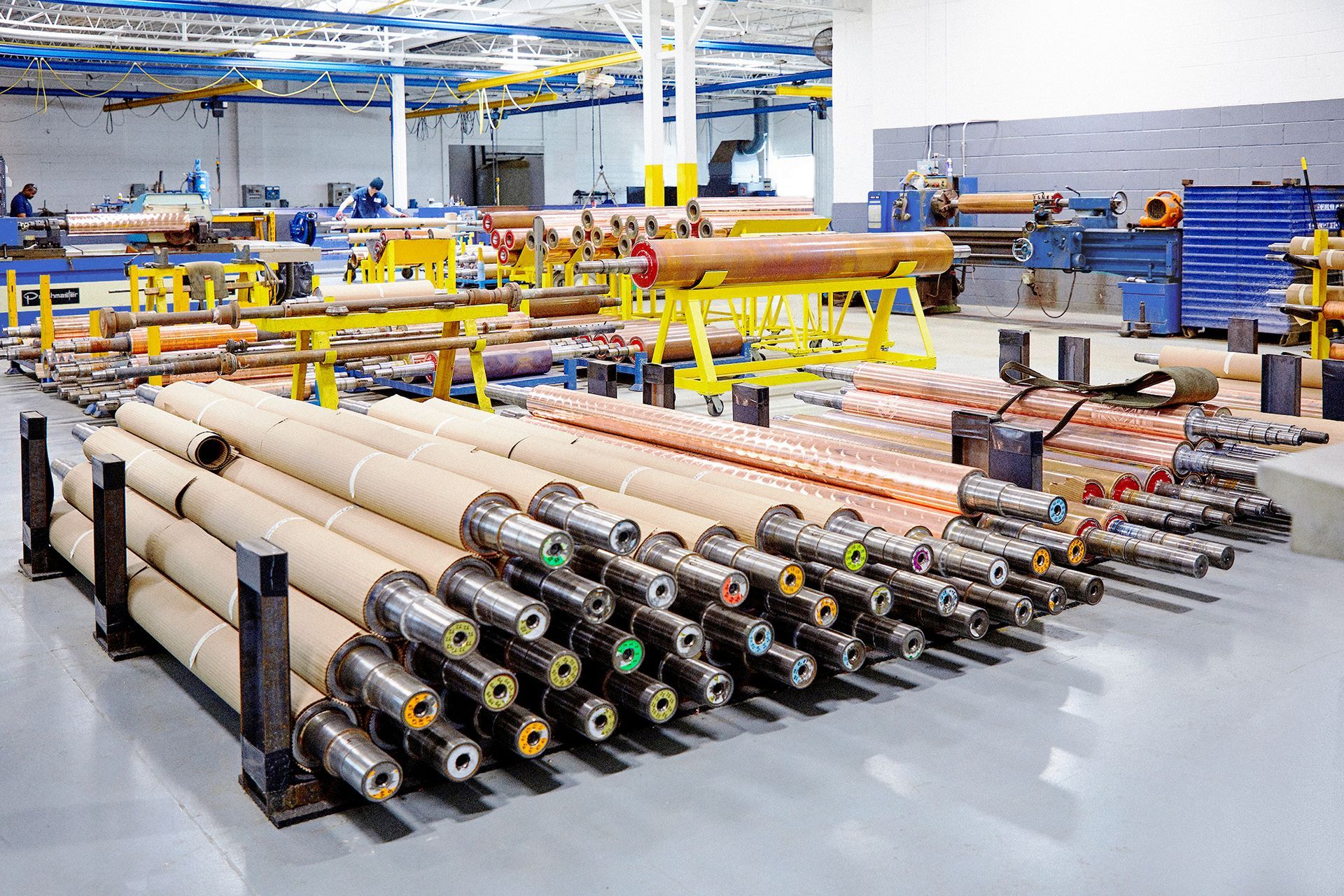 A large warehouse filled with lots of metal pipes.