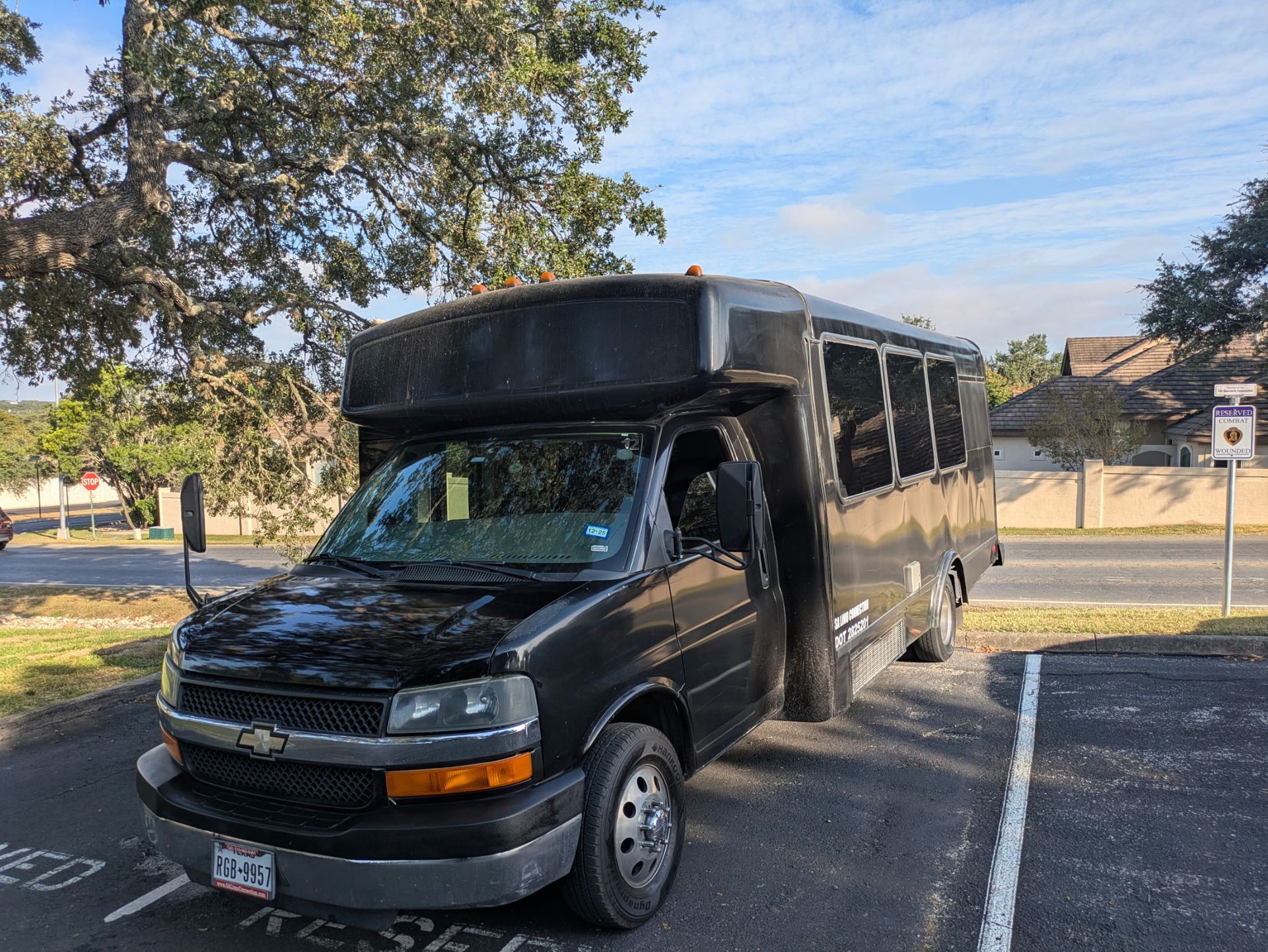 Blue Line San Antonio Party Bus Up to 16 passengers daytime outside view parked in Leon Springs