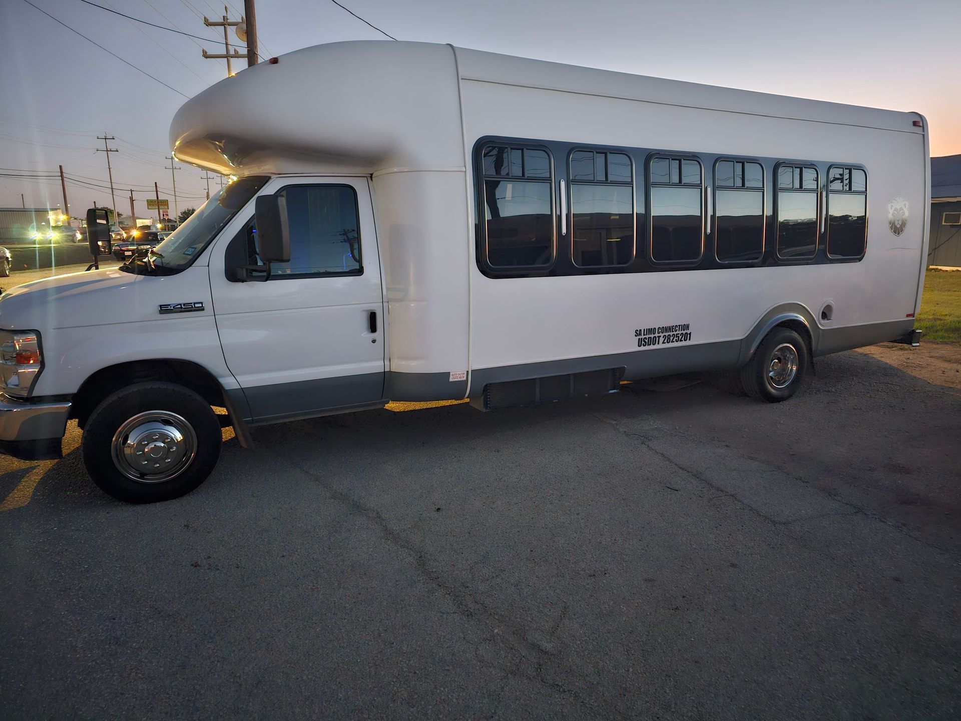 D Town SATX San Antonio party bus for up to 24 passengers exterior view parked in Stone Oak