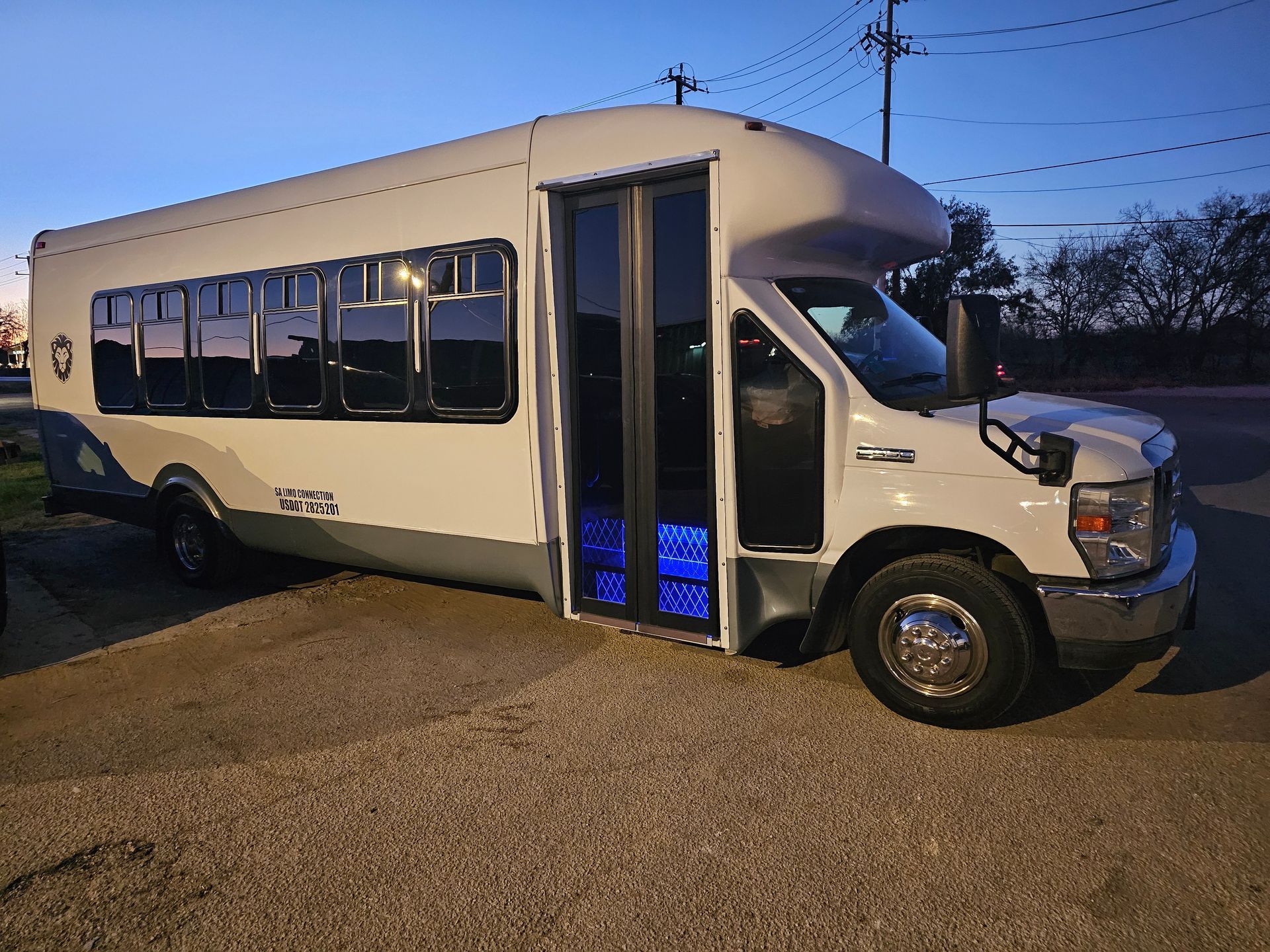 D Town SATX San Antonio white party bus for up to 24 passengers exterior view parked in Stone Oak
