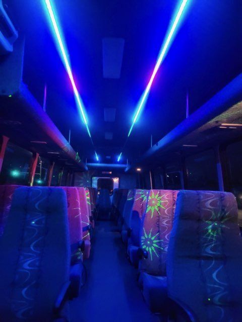 San Antonio Executive shuttle bus for up to 37 passengers Nightlife atmosphere inside view SATX