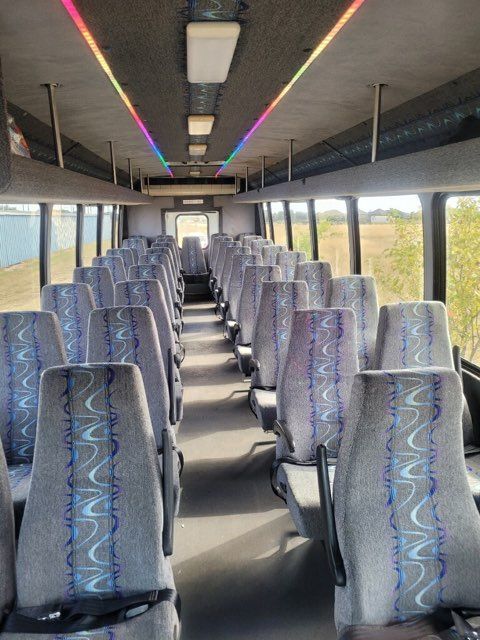 San Antonio corporate shuttle bus party lights turned on for up to 37 passengers inside view SATX
