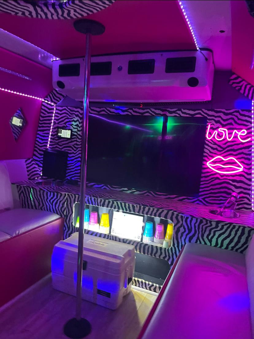 pink Austin party bus with inside view