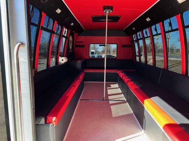 inside view of a white 20 passenger party bus for SATX