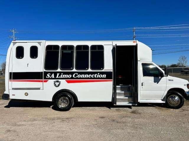 white 20 passenger party bus for SATX outside view